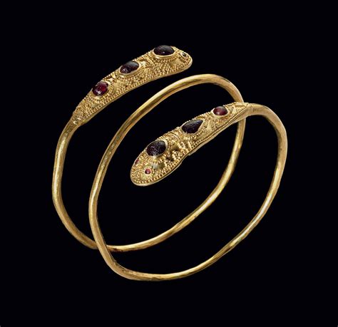 AN EASTERN ROMAN OR SARMATIAN GOLD, GARNET AND GLASS BRACELET , CIRCA ...