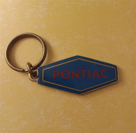 Vintage Pontiac Keychain Logo Teal Red Gold Metal Car Vehicle Make Rare