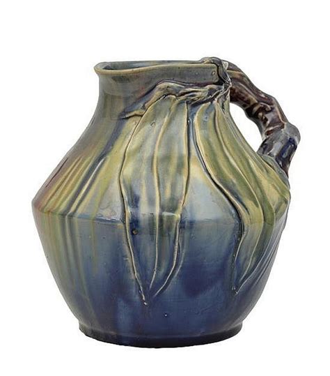 A Remued Jug Glazed In Green Purple And Red Tones With Classic