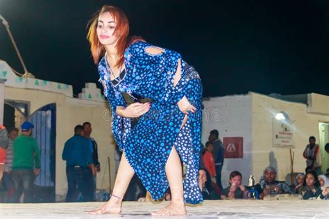 Young Woman Performs Arabic Traditional Belly Dance In The Desert Camp