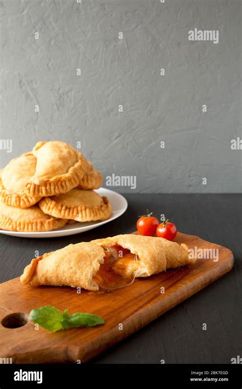 Homemade Deep Fried Italian Panzerotti Calzone With Sauce Side View