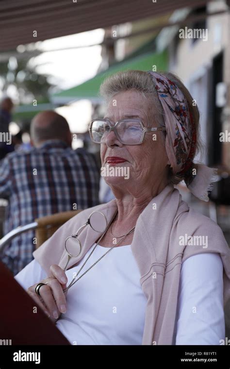 Attractive 78 year old woman during a summer restaurant visit ...