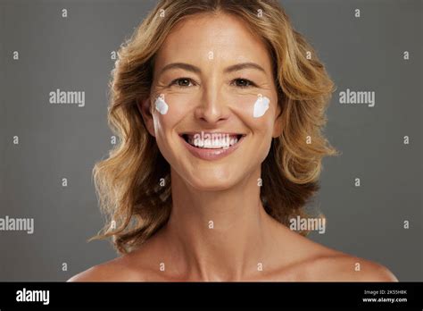 Face Cream Mature Skincare And Woman With Beauty From Cosmetics Against A Grey Mockup Studio