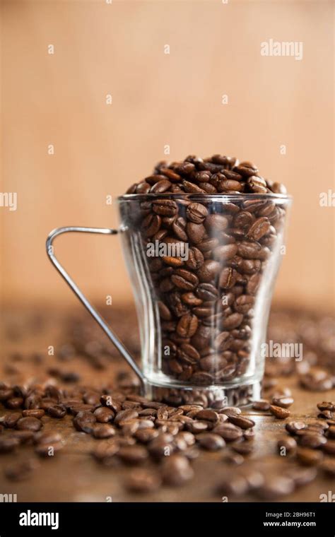 Transparent Glass Cup Filled With Coffee Beans Stock Photo Alamy