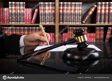 Judge Writing On Paper Stock Photo AndreyPopov 142433445