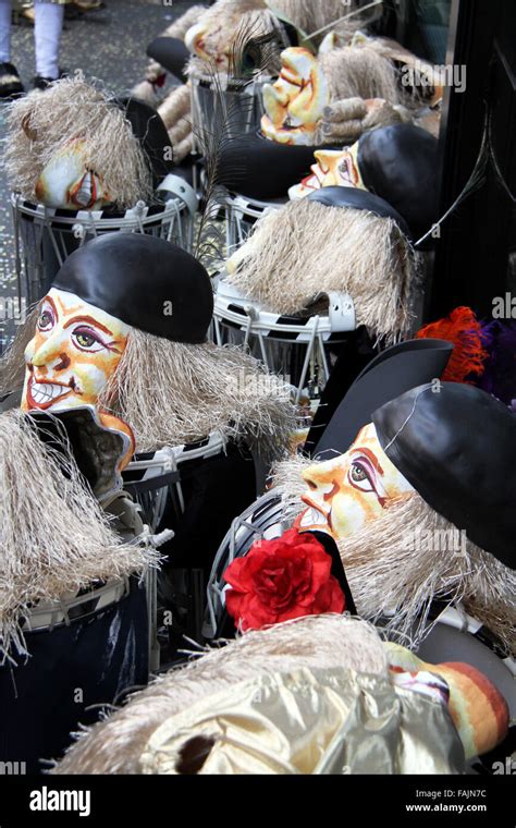 basel carnival masks showing smiling faces gray hair  black