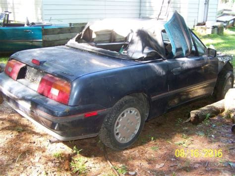 TWO MERCURY CAPRI CONVERTIBLES 1991 AND A 1993