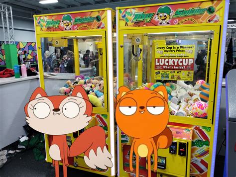 Kiff And Candle Fox In Front Of Claw Machines By Joeyhensonstudios On