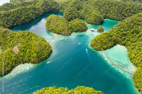 Cove And Blue Lagoon Among Small Islands Covered With Rainforest Sugba