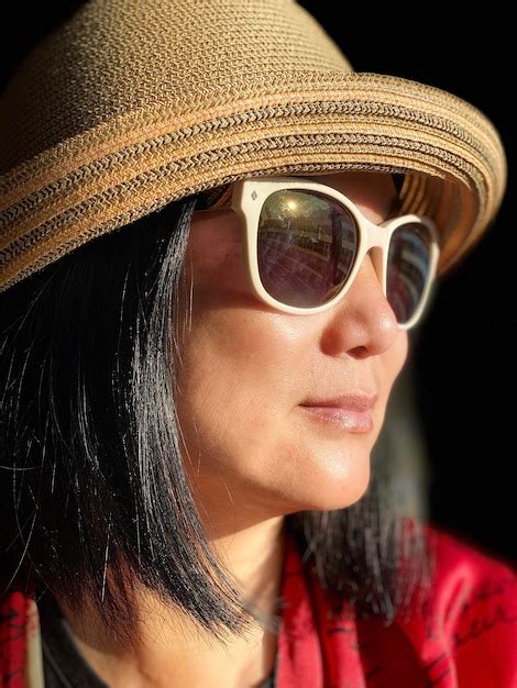 Premium Photo Close Up Of Woman Wearing Sunglasses Looking Away