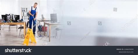 Male Janitor Cleaning Floor Caution Wet Stock Photo