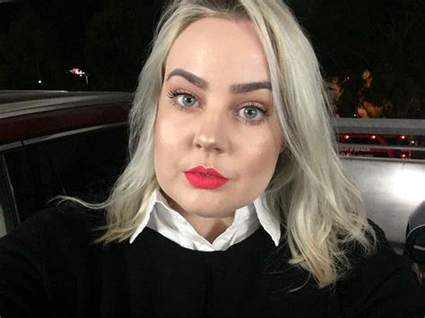 Blonde Woman In Black Shirt With Red Lipstick