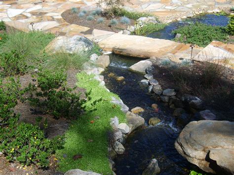 Babbling Brook Runs Through This Stone Patio The Stone Bridge Adds A