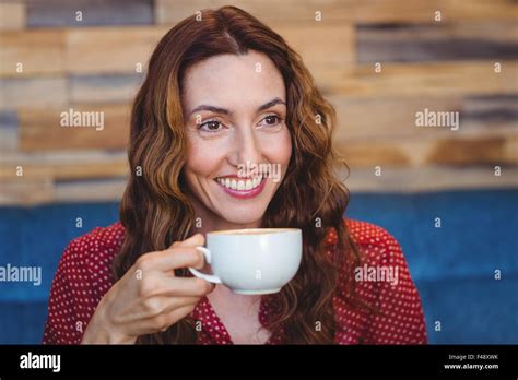 Happy Pretty Brunette Drinking Coffee Stock Photo Alamy