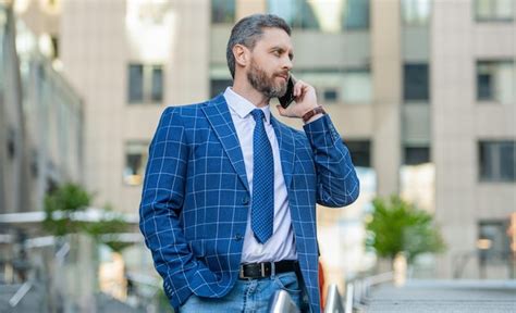 Premium Photo Confident Businessman Has Phone Call Outdoor