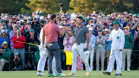 Masters Champion Jon Rahm Of Spain Shakes Hands With Brooks Koepka Of