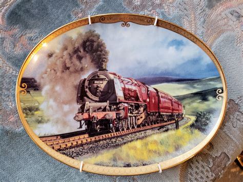 Solve Ornamental Plate Featuring A Steam Locomotive Jigsaw Puzzle