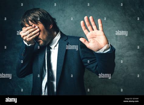 crooked politician hiding face  newspaper photographers