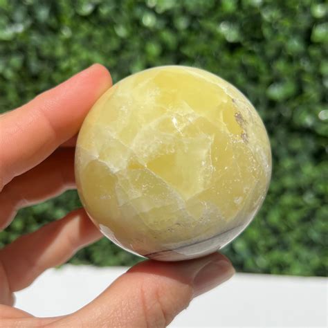 Golden Calcite Crystal Sphere The Crystal Society Pty Ltd