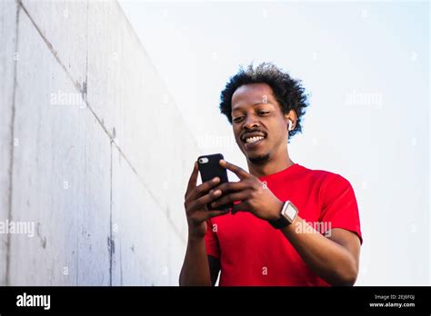 Athlete Man Using His Mobile Phone Outdoors Stock Photo Alamy