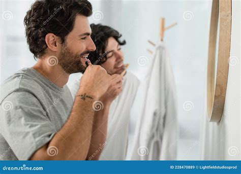 Smiling Gay Couple Brushing Teeth In Stock Image Image Of Mirror Emotion