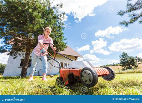 Woman Mowing Green Grass Stock Photo Image Of Gardening 159359666