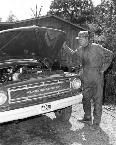 John Wayne Looks Under Hood Of International Truck Photograph