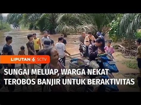 Sungai Meluap Warga Musi Rawas Nekat Terjang Banjir Untuk Beraktivitas