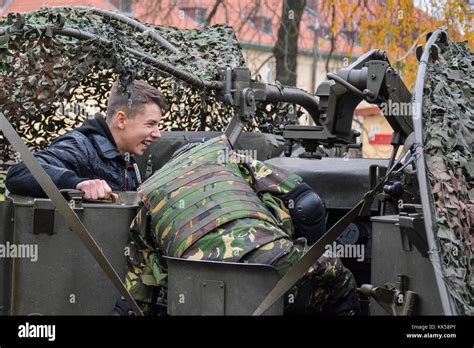 A Romanian Soldier Provides A Weapons Demonstration For A Local Polish