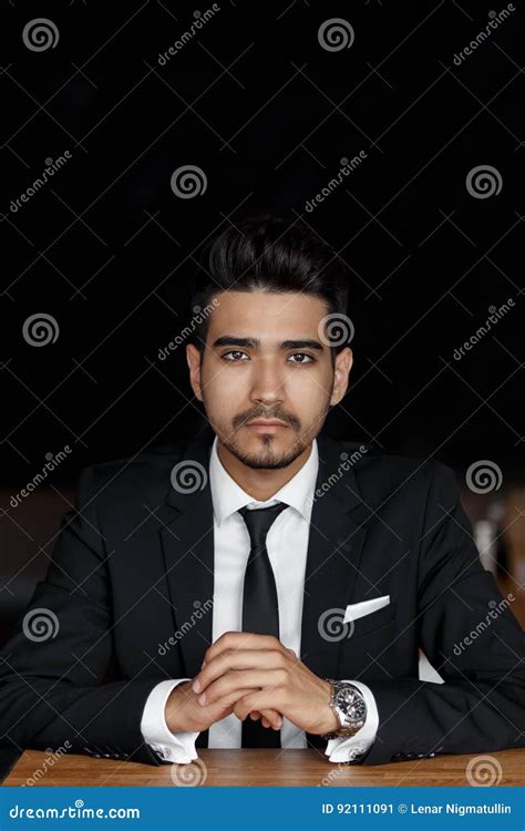 Handsome Confident Young Man In Suit Sitting In Cafe Hands On The