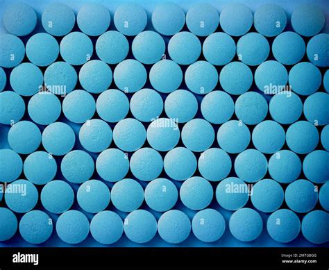 Round Blue Pills On A Flat Surface Potency Pharmacology Close Up