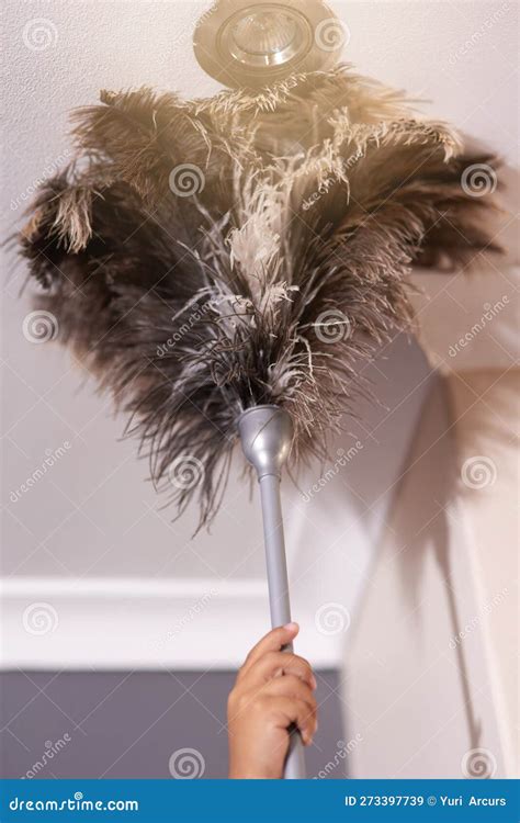 The Dust Didnt Stand A Chance A Person Dusting The Ceiling With A