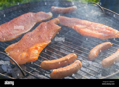 Meat on a charcoal grill at a barbecue Stock Photo - Alamy