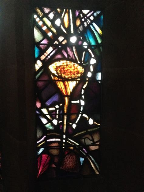 A Stained Glass Window With A Gold Spoon In It S Center And Colorful