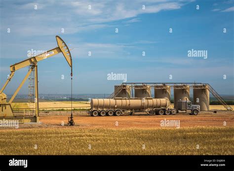 An Oil Pumper Oil Storage Tanks And A Truck In The Bakken Play Oil F