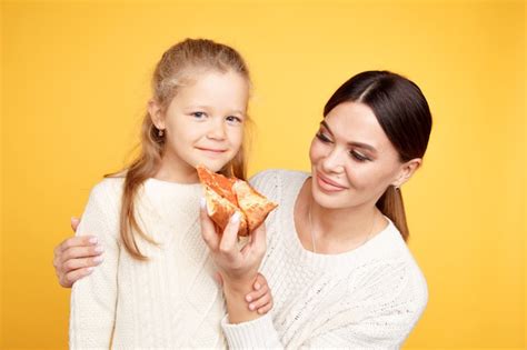 Premium Photo Mother And Daughter Sitting In The Kitchen Eating