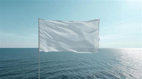 Una Bandera Blanca Volando En El Viento Sobre Un Cuerpo De Agua Foto