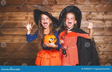 Funny Children Sister Twins Girl In Witch Costume In Halloween Stock