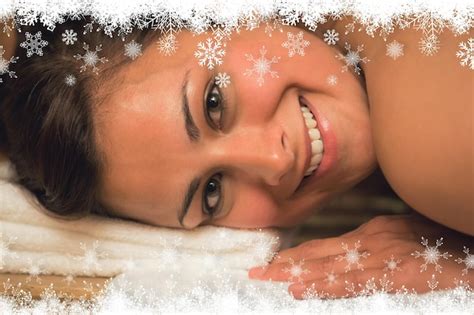 Premium Photo Happy Brunette Lying In A Sauna Looking At Camera