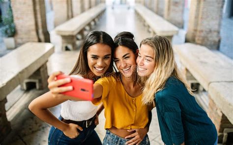 Group Of Multiracial Young Women Taking Selfie Photo On Cellphone