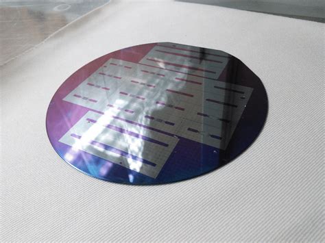 21: Etched Silicon wafer with microfluidic device pattern. The Silicon ...