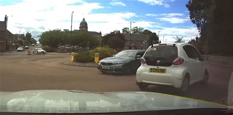 Shocking Moment Elderly Driver Goes Wrong Way Round Roundabout