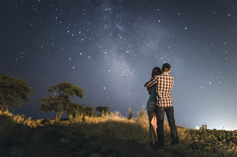 Couple In Love Under Stars Of Milky Way Galaxy Stock Photo Download