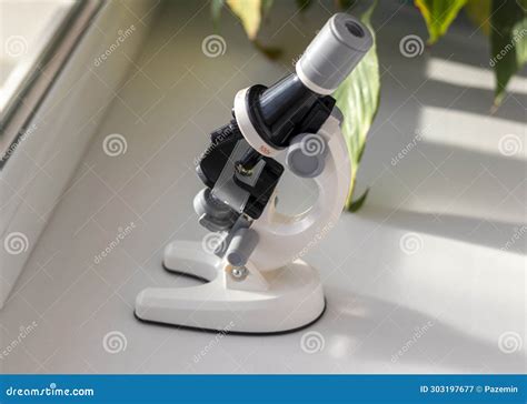 Close Up Shot Of The Microscope On The Window Science Stock Image