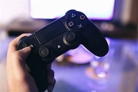 Person Holding Sony Ps4 Dualshock 4 · Stock Graphy Ps4 Hd Wallpaper