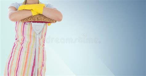 Female Cleaner Standing With Mop Against Blue Background Stock Image
