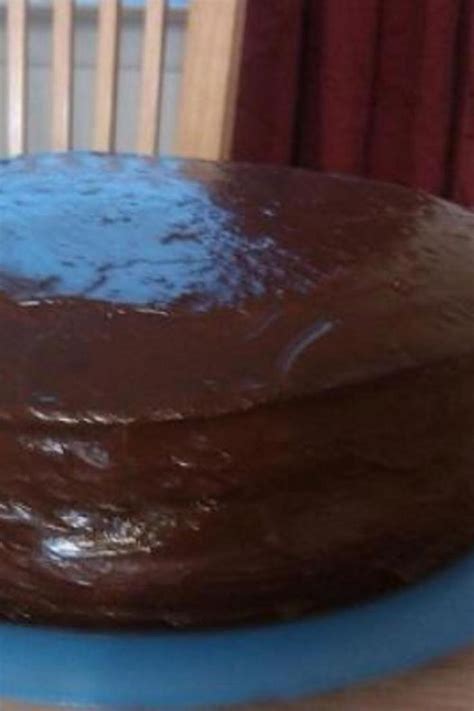 A Chocolate Cake Sitting On Top Of A Blue Plate