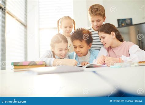 Friends Helping With Homework Stock Image Image Of Classroom Males