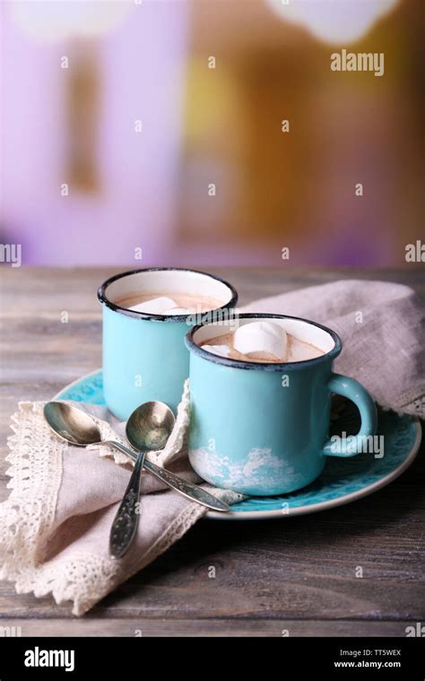 Cups Of Tasty Hot Cocoa On Wooden Table On Light Background Stock Photo Alamy
