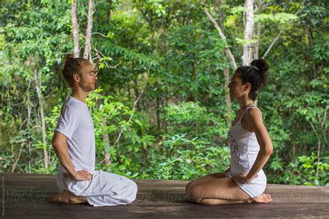 "Two People Meditating Facing Each Other" by Stocksy Contributor "Mosuno" - Stocksy